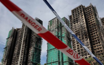 Hong Kong mourns victims of blaze that killed 128 and counting