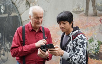 Through street photography workshops, visitors explore Hanoi one frame at a time