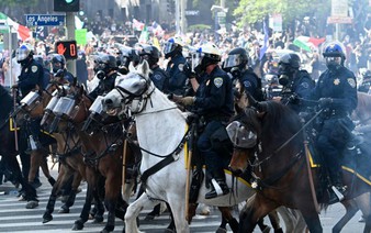 Curfew lifted in LA as Trump battles for control of California troops
