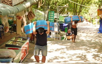 On a steep climb, porters haul heavy loads up sacred mountain in Vietnam’s Tay Ninh