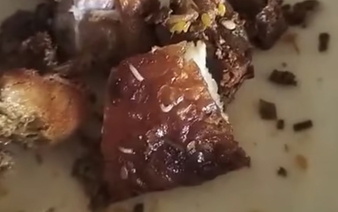Authorities investigate claim of maggot-infested roast pork sold at Vietnam local market