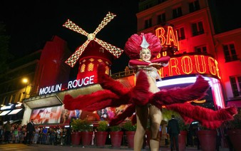 Moulin Rouge windmill twirls again 14 months after accident