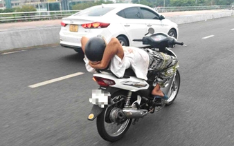 Man with history of mental illness lies back, rides motorcycle hands-free in Da Nang