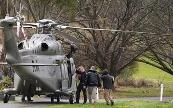 Manhunt continues in Australian bush for 'heavily armed' suspect after two officers shot dead