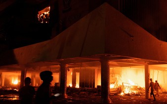 3 dead as Indonesian protesters set fire to regional parliament building