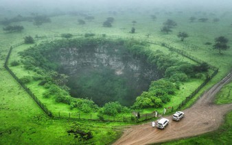 Mind the gap: tourists drawn to Oman's giant sinkholes