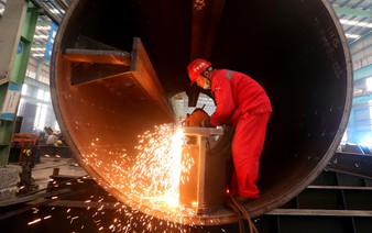 Asia's factories end 2025 on firmer footing as orders pick up