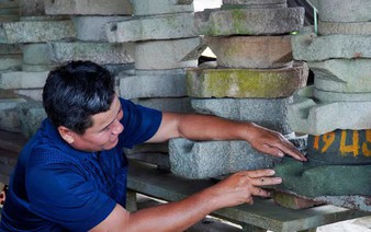 Vietnamese farmer preserves rural memories through collection of centuries-old stone mills