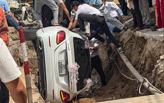 Vietnamese bride rescued after Mercedes wedding car flips into road construction trench