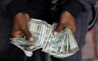 Rupee slips, lags most Asian peers in conjunction with local stocks