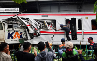 Indonesia train crash toll rises to 14 as rescuers work to remove trapped passengers