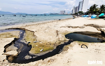 Foul-smelling water flows from drainage outlet into Vietnam’s Nha Trang bay