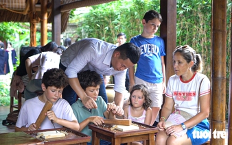 Foreign tourists try carpentry at Temple of Literature in Hanoi