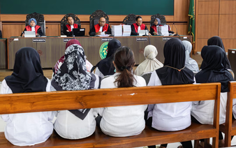 Indonesian court begins trial of daycare staffers in alleged child abuse case