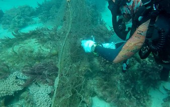 Conservationists, fishermen dive to remove ‘ghost nets’ off central Vietnam island