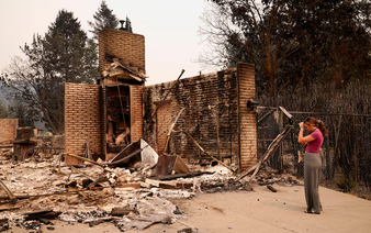 Wildfires near Spokane destroy more than 700 buildings, force 64,000 to flee