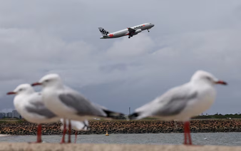 Australia's Jetstar to charge for carry-on bags in overhead lockers