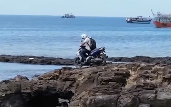 Foreign tourist rides motorbike onto Vietnam's protected  landmark despite warnings