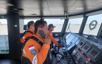 Indonesia rescuers battle turbulent seas in search for 129 people after passenger ship capsizes