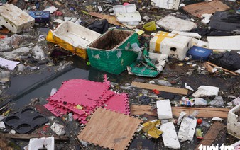 Historic rain leaves Vietnam’s ancient citadel moat choked with trash
