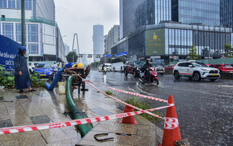 Pumps deployed to drain flooding at Ho Chi Minh City’s iconic bridge