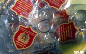 Vietnamese police give locals free emergency call keychains for better crime control