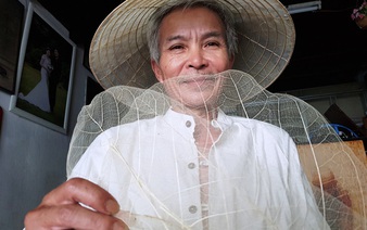 Vietnamese man makes traditional conical hat from almond leaf