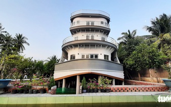 Vietnamese farmer builds yacht-shaped house as ode to life on the high seas