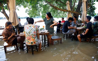 Riverside restaurant makes waves in Thailand as flood dining goes viral