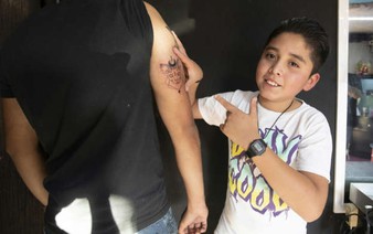 Mexican 11-year-old tattooist follows in father's footsteps
