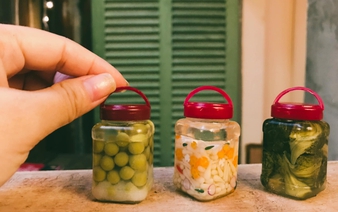 Vietnamese woman creates mini clay models of traditional Tet meals