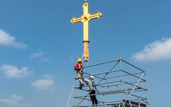 Gold-plated crosses return to Notre-Dame Cathedral towers in Ho Chi Minh City