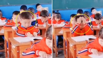 Bé trai bốc chữ từng trang giấy xoa lên đầu