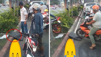 Đoàn người đi xe máy kê ván, leo qua dải phân cách để tránh kẹt xe