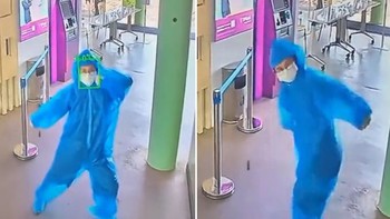 Cô gái nhảy múa trước camera đo thân nhiệt