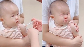 Bé trai mếu máo khi bác sĩ nựng má