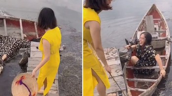 Pha bước lên thuyền ngã xuống lòng ao khi chụp hình