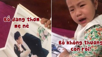 Bé gái mếu máo khi xem ảnh cưới bố mẹ