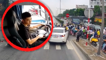 Tài xế xe đầu kéo chắn đường giúp học sinh qua quốc lộ an toàn