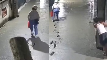 Người phụ nữ để lại hàng trăm dấu chân trên đường bê tông vừa đổ