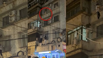 Thanh niên leo 4 tầng để giải cứu bé trai mắc kẹt 'chuồng cọp'