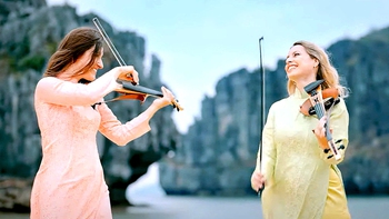 Bond mặc áo dài, chơi bản nhạc kinh điển 'Victory' giữa Hạ Long