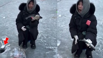 Cô gái đang sung sướng vì câu được cá thì rơi mất điện thoại