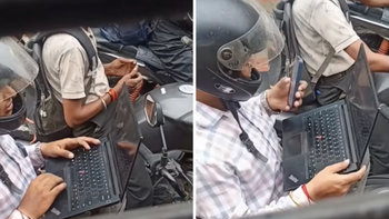 Dân mạng tranh cãi cảnh mở laptop làm việc khi dừng đèn đỏ