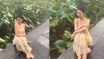 Mặc kệ mưa to gió lớn, cô gái vẫn bình thản tạo dáng thật 'slay'