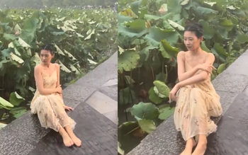 Mặc kệ mưa to gió lớn, cô gái vẫn bình thản tạo dáng thật 'slay'