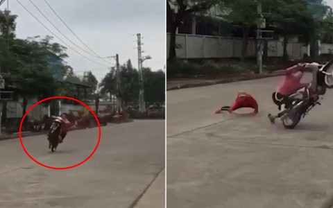 Quái xế bốc đầu xe máy vứt bạn ngã sấp mặt xuống đường bê tông