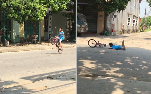 Cậu bé ngã sấp mặt vì trổ tài đi xe đạp một bánh