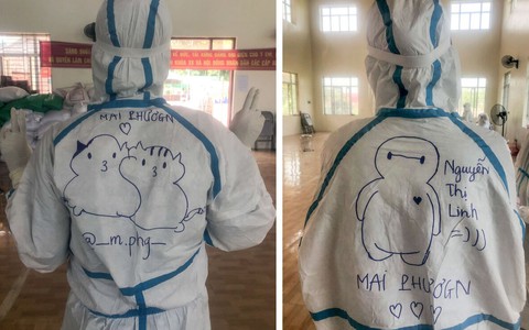 Những dòng chữ lạc quan trên bộ đồ bảo hộ của y bác sĩ ở tâm dịch