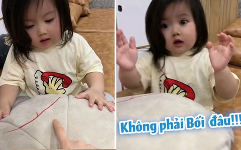 Cô con gái xua tay chối khi bị mẹ bắt tội vẽ bậy